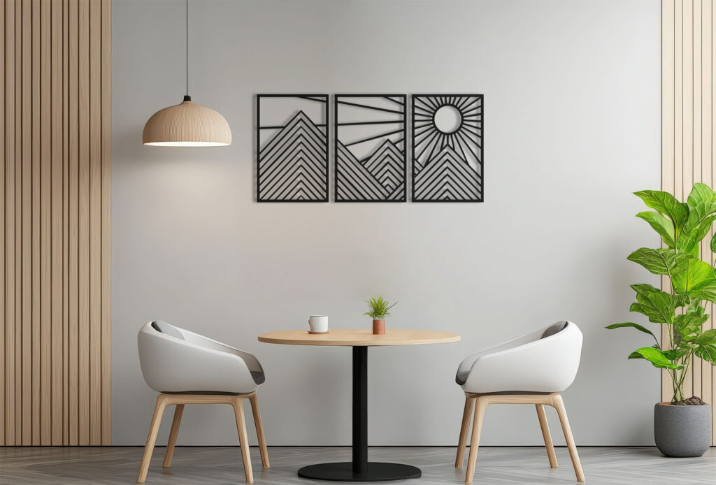 A white and orange framed picture hangs on a wall in a room with a table and two chairs